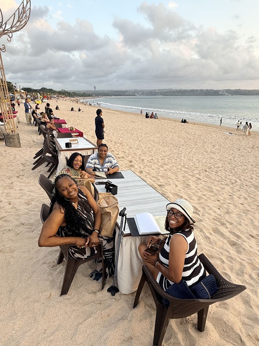 A birthday group celebrating at a beachside dinner in Bali